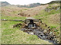 Stone footbridge over stream, Elterwater in LA22 9HN