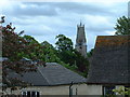 Church over the suburban roof-tops in GL6 9LF