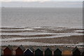 Beach huts and incoming tide, Herne Bay in CT6 8HX