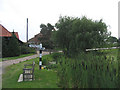 Pond and fingerpost, Woodhatch, Epping, Essex in CM16 7PU