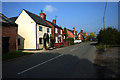 Houses along the main road in Shocklach in SY14 7BL
