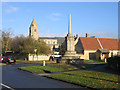 Butter Cross and parish church, Helpston, Peterborough in PE6 7DQ