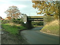 Low road passing under the railway. in NR13 5BH