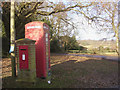 Telephone box and postbox at a junction in Newtown, New Forest in SO43 7GH