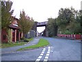 Disused railway bridge and sign for Transpennine Trail in WA4 1AF
