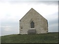 The chancel end of St Cwyfan's Church in LL63 5YR