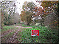 Farm road crossing the Marriott's Way in NR10 4RR