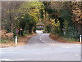 The Street and the railway bridge on the road to Nacton in IP10 0DQ