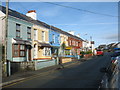 A terrace of shops and houses in the High Street, Rhosneigr in LL64 5UQ