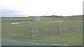 Footpath and waterlogged farmland south of the A 4080 in LL64 5QZ