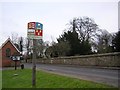 Village sign and church, Roxwell in CM1 4LS