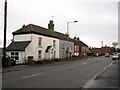 View south past cottages on the B1150 (Norwich Road) in NR28 0TF