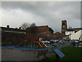 Car park, disused church, town wall and play area in NR30 2RW