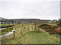 Stile and footpath on flood defence embankment beside Afon Artro in LL45 2NL