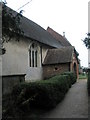 Side view of All Saints, Upper Farringdon in GU34 3EH
