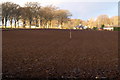 View of Dykehead Village across a ploughed field in DD8 4QE