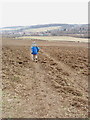 Footpath across ploughed field, with view to Amersham in HP7 0JT