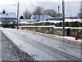 Shaftesbury: snow-topped wall and hedge, Bleke Street in SP7 8EB
