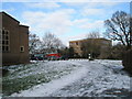 Looking round the east wall towards the car park at Guildford Cathedral in GU2 7JL
