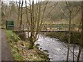 Footbridge across Hebden Water to the bowling green below Lee Mill Bridge in HX7 8SN