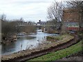 South Vale footbridge and River Caldew in CA2 5SF
