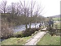 Riverside path footbridge near Grassington in BD23 5ND