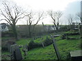 Old graves at Llanfaelog Parish Church in LL63 5TA