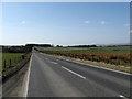 The A6094 heading past Upper Firth Farm in EH26 8QG