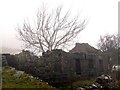 Derelict cottage in low cloud in LL55 3EP