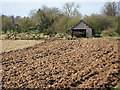 Freshly ploughed land in HR1 4JY