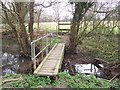 Long footbridge and stile in TN27 9LE