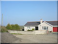 Bungalow alongside the A5025 in LL68 0SW