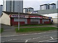 Derelict shops on Western Road in G72 8TR