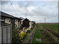 Houses beside the River Thurne in NR29 5JN