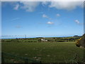 View across pasturage towards Gwenithfryn farmhouse in LL68 0SG