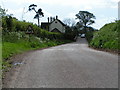 Road and house south of Beacon Cross in EX5 2SA