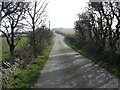 The road east to Tregele rising towards the Firs Country Hotel in LL67 0DH