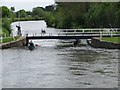 Canoeists pass under the swing bridge in EX2 8QW