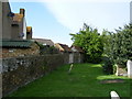 Churchyard and rear of houses in The Street Iwade in ME9 8FW