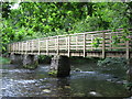 Footbridge over river between Rydal Water and Grasmere in LA22 9SQ
