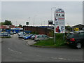 Car sales business beside Wilderspool Bridge in WA1 1QL