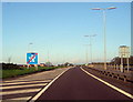 Road sign marking the end of motorway regulations. in DG16 5LG