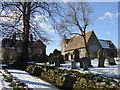 Gravestones and Church Hall, Barnston in CH61 1BY