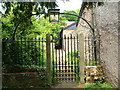Gate and path from Feniton churchyard in EX14 3FD