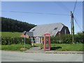 Sarn village hall and telephone box in SY16 4EJ