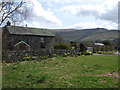 Stone house and Black Mountains in Talgarth Community