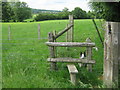 Footpath junction on stile near Elvey Farmhouse in TN25 4JP