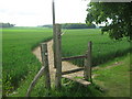 Stile on North Downs Way towards Skeats Wood in TN25 4JT