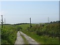 Farm road linking Pen-gwydd with the B5111 at Rhosybol in Rhosybol Community