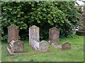 Three gravestones in a row at St. Andrews Church Colne Engaine in CO6 2JG